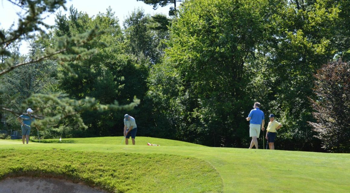 Several people on a golf course