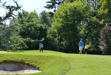 Several people on a golf course