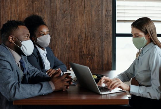 People having a meeting with masks on
