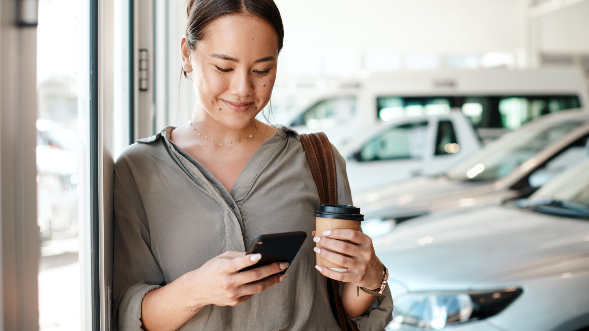 Shot of a young woman using her smartphone to send text messages