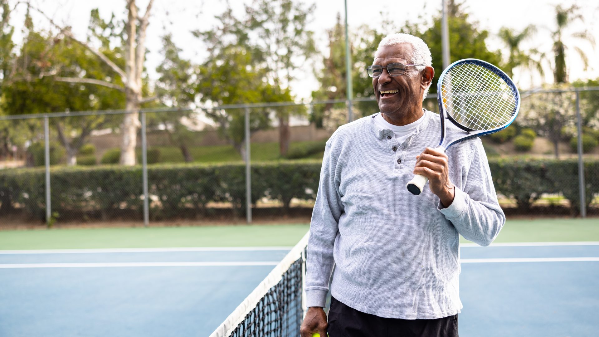 Portrait of a senior black man on the tennis court