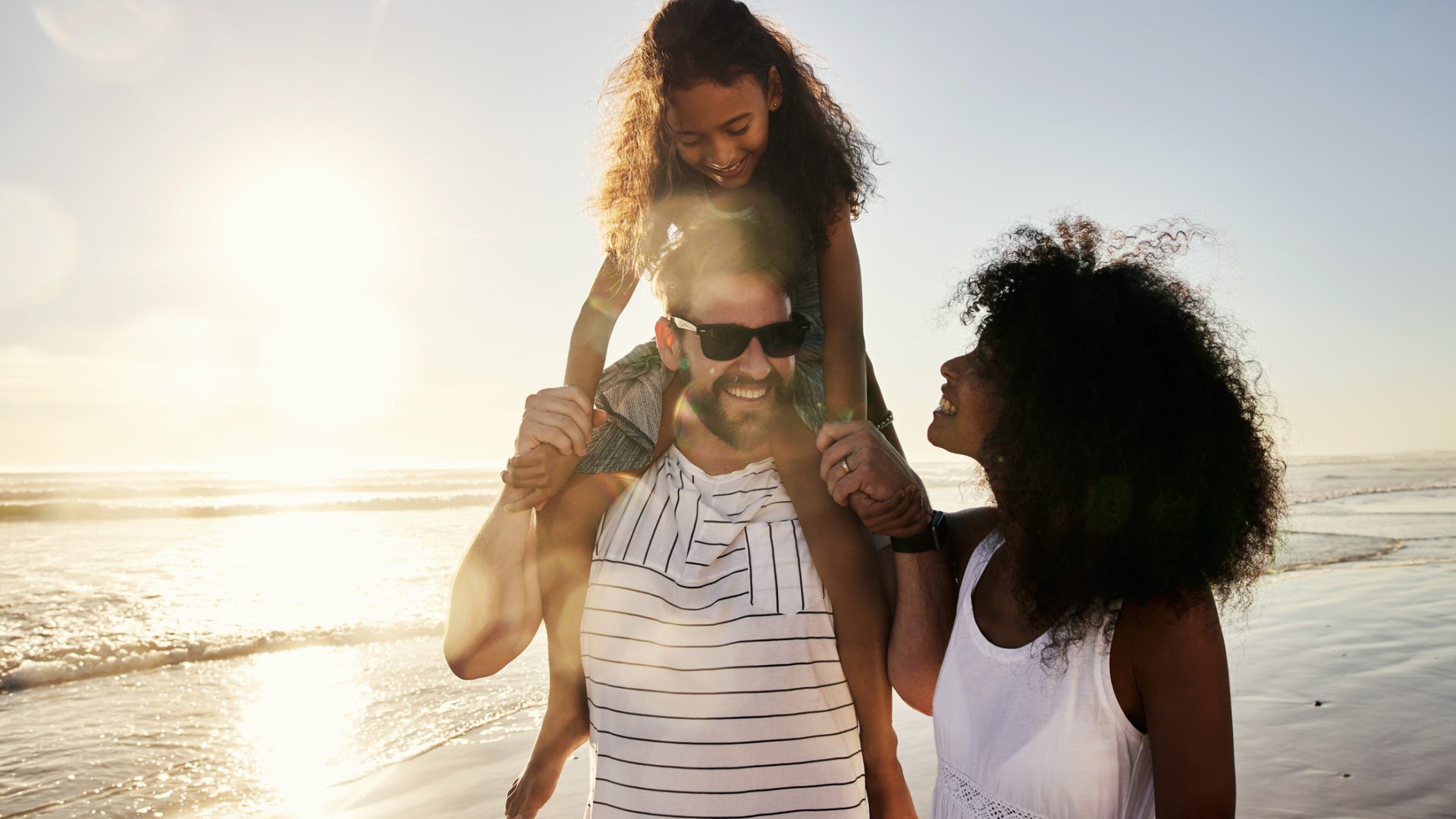 Shot of a happy family spending time at the beach