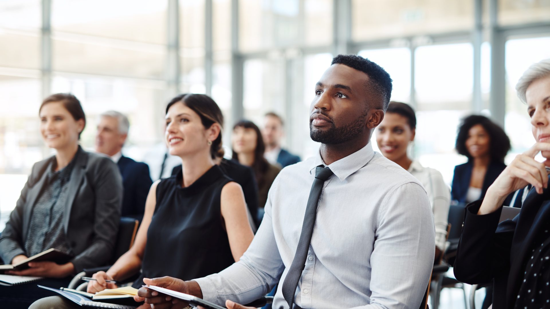 Shot of a group of businesspeople attending a conference