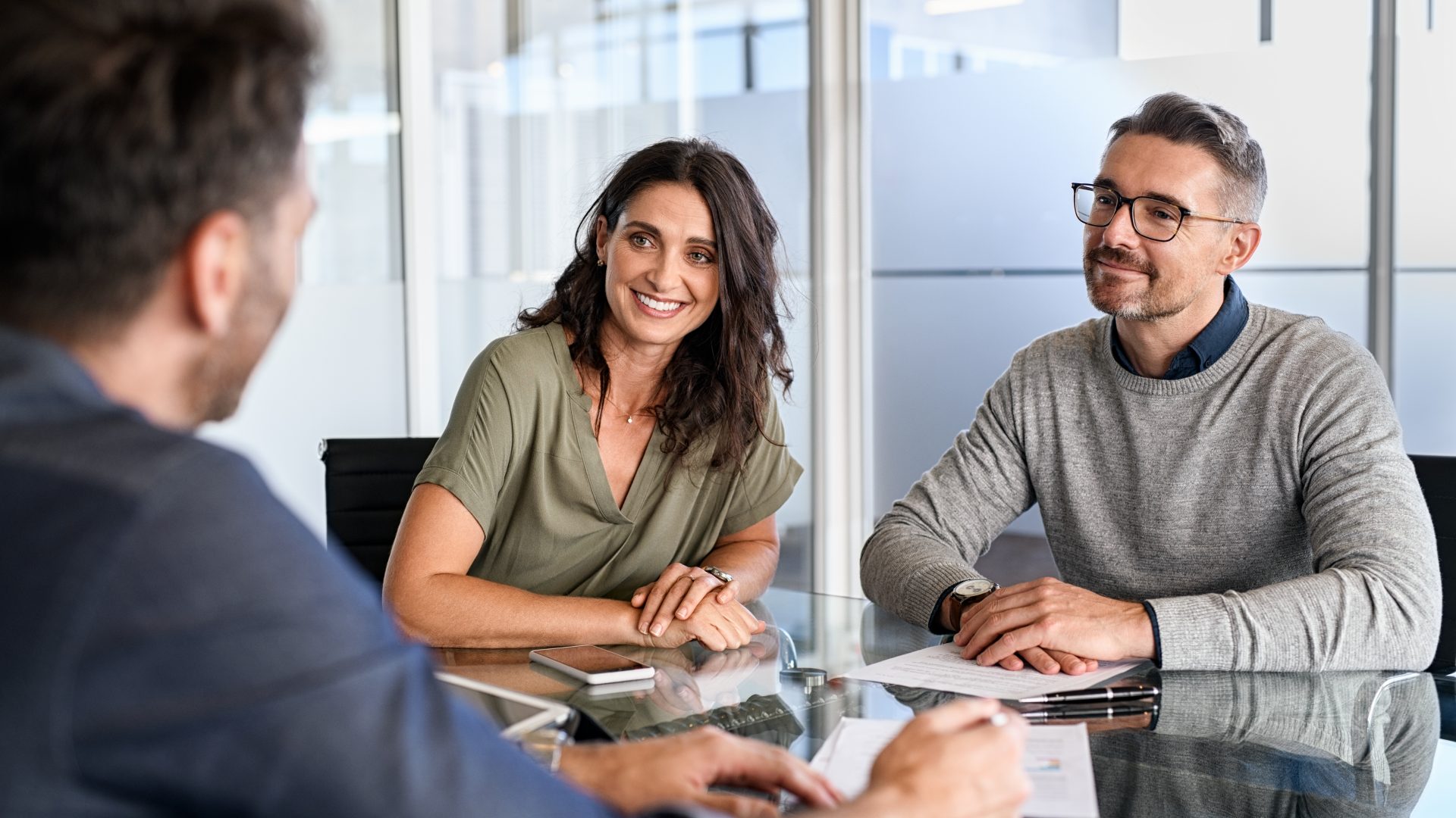 Mature couple meeting financial advisor for investment