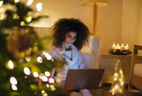 Black girl alone working for Christmas in her living room