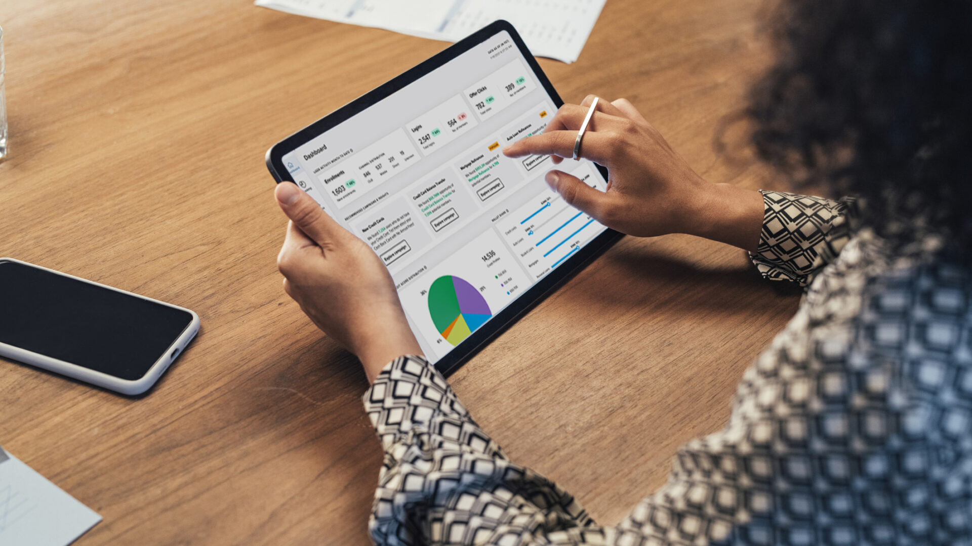 Anonymous Businesswoman Analyzing Statistical Business Reports on her Tablet PC at the Office, a Close Up