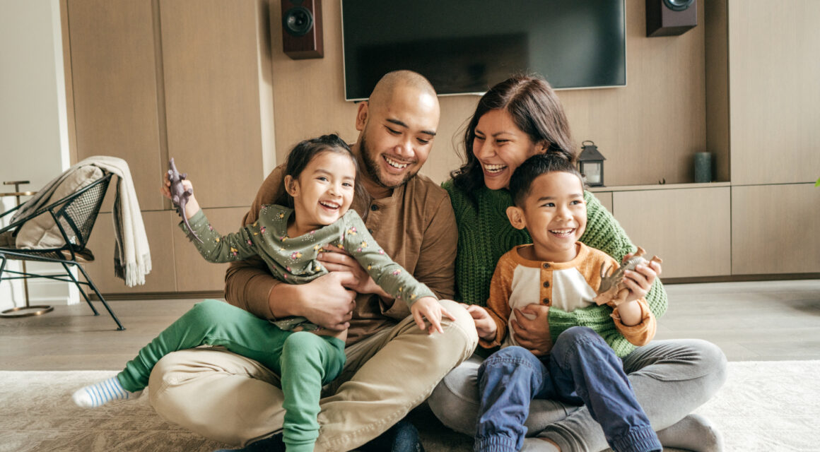 Happy family at home on winter holidays