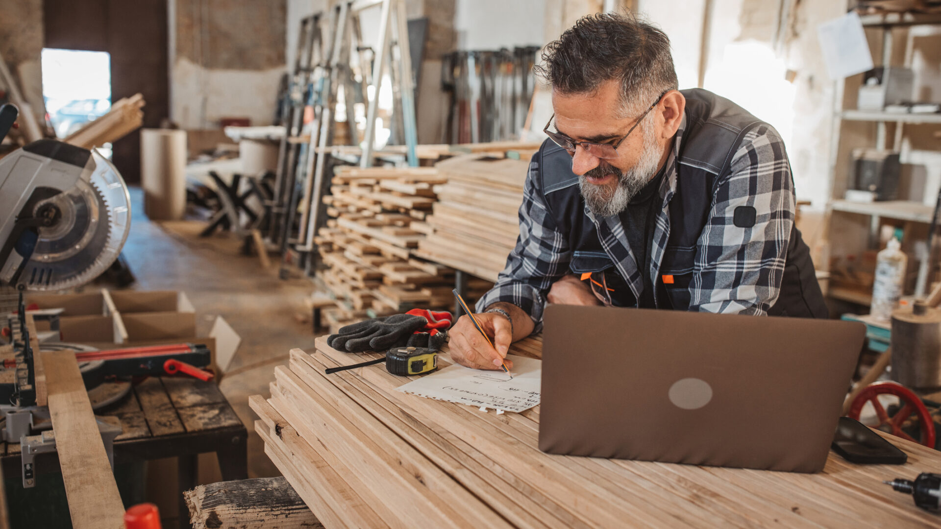 Carpenter in wood workshop