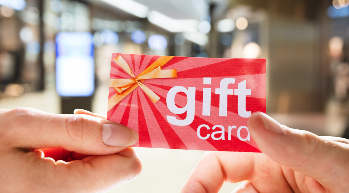 hands holding gift card
