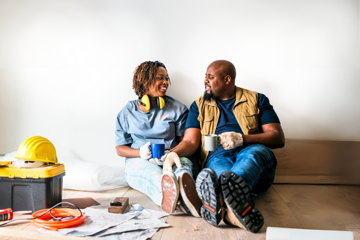 black couple enjoying coffee after a DIY home project