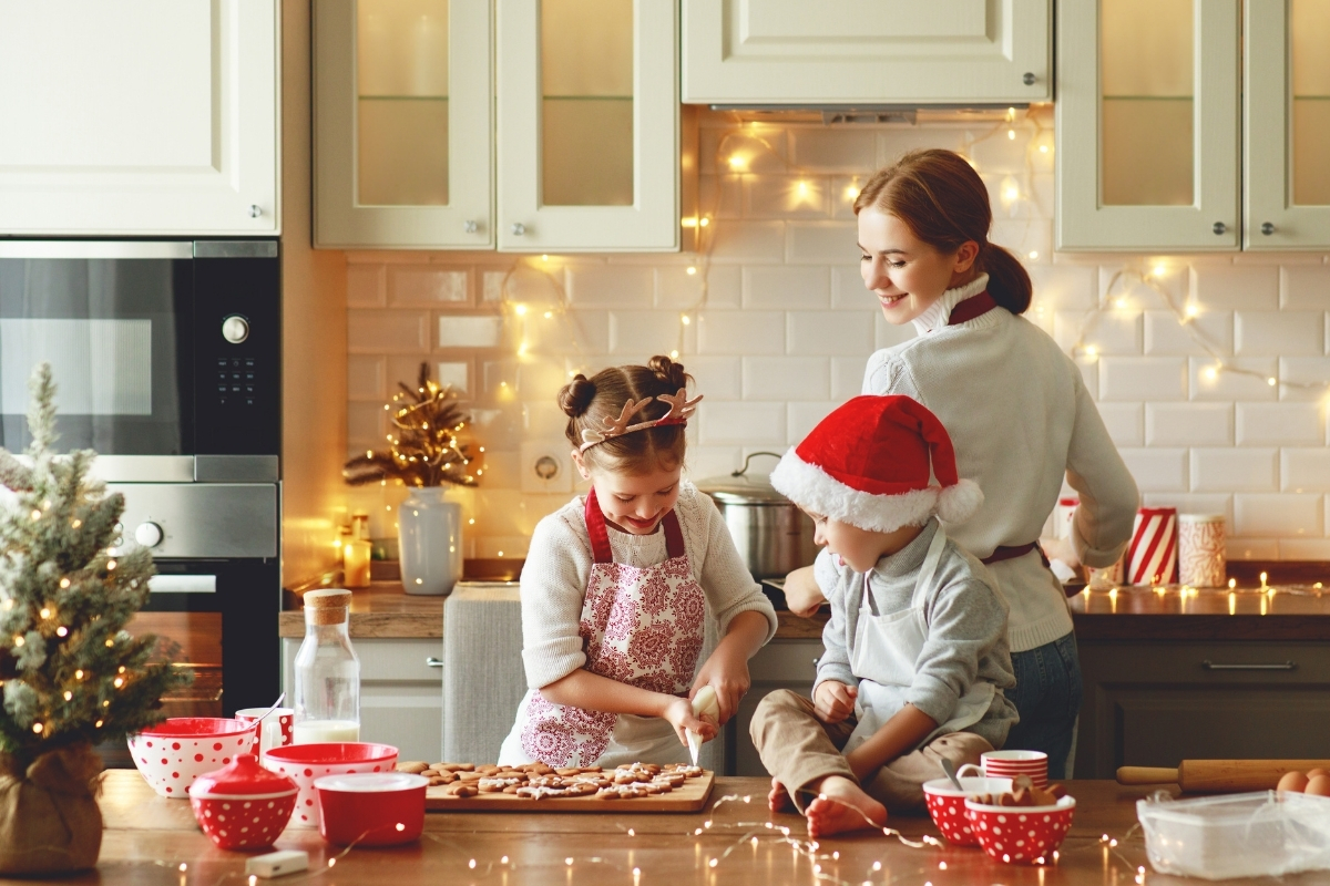 family making cookies in kitchen - christmas theme
